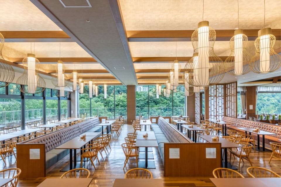 Spacious buffet dining hall with forest views