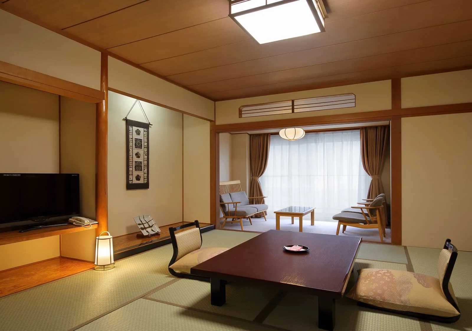 Spacious Japanese-style tatami room with low table and sitting area