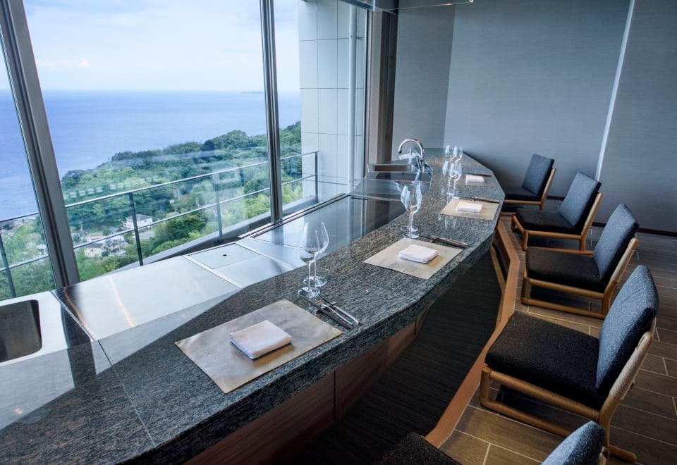 Atami Sekaie teppanyaki counter set for dinner with panoramic Sagami Bay ocean view