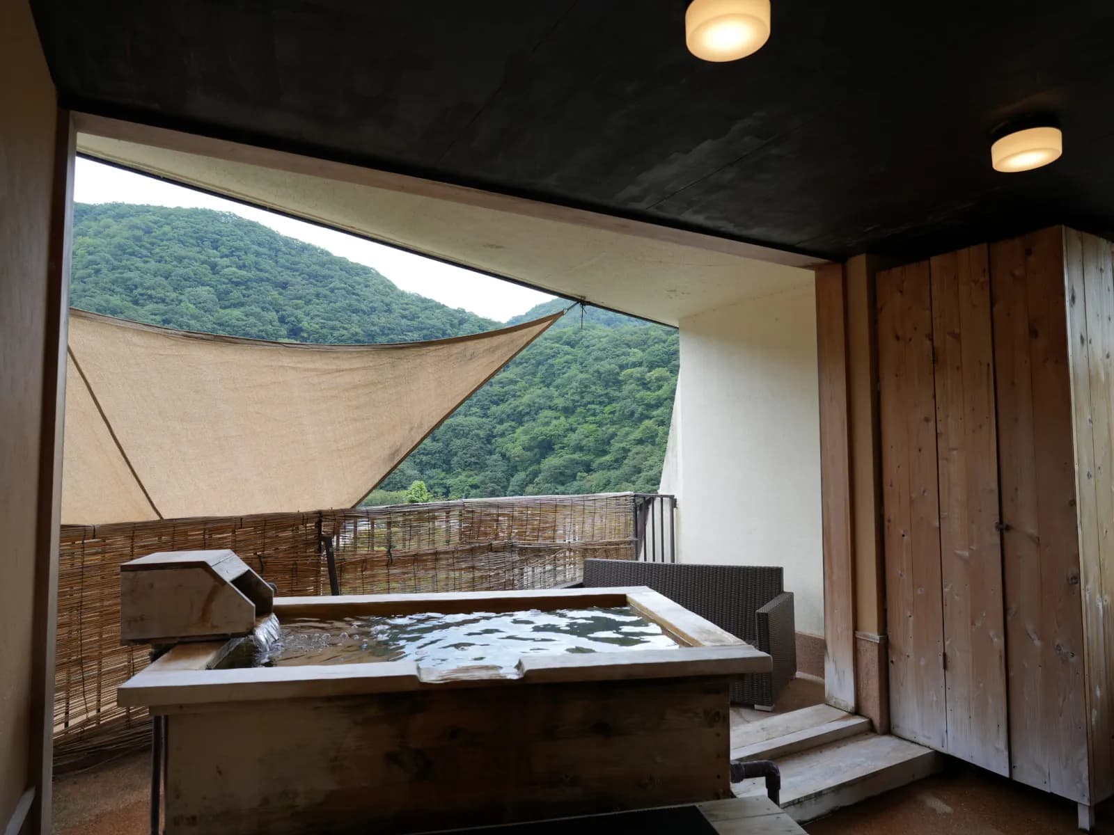 Private open-air rock bath with mountain view