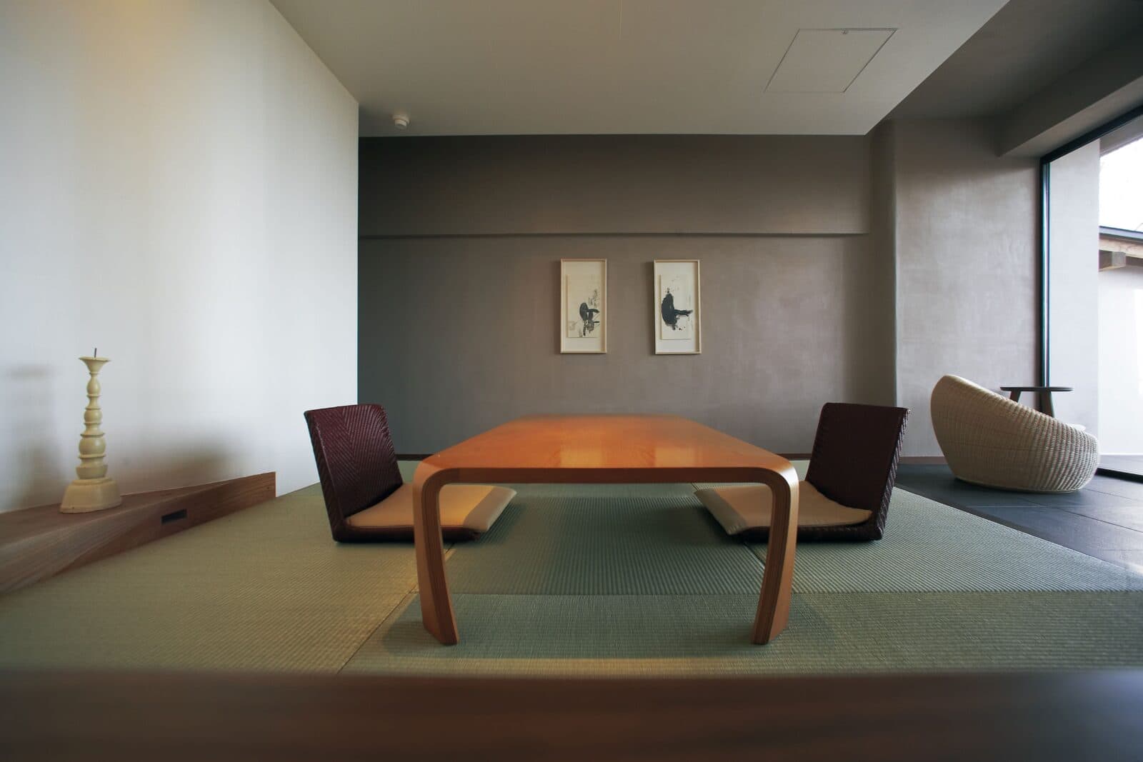 Minimalist suite living room with a low wooden table on tatami