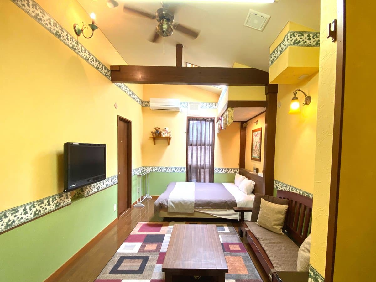 Bright guest room with sofa lounge and low table