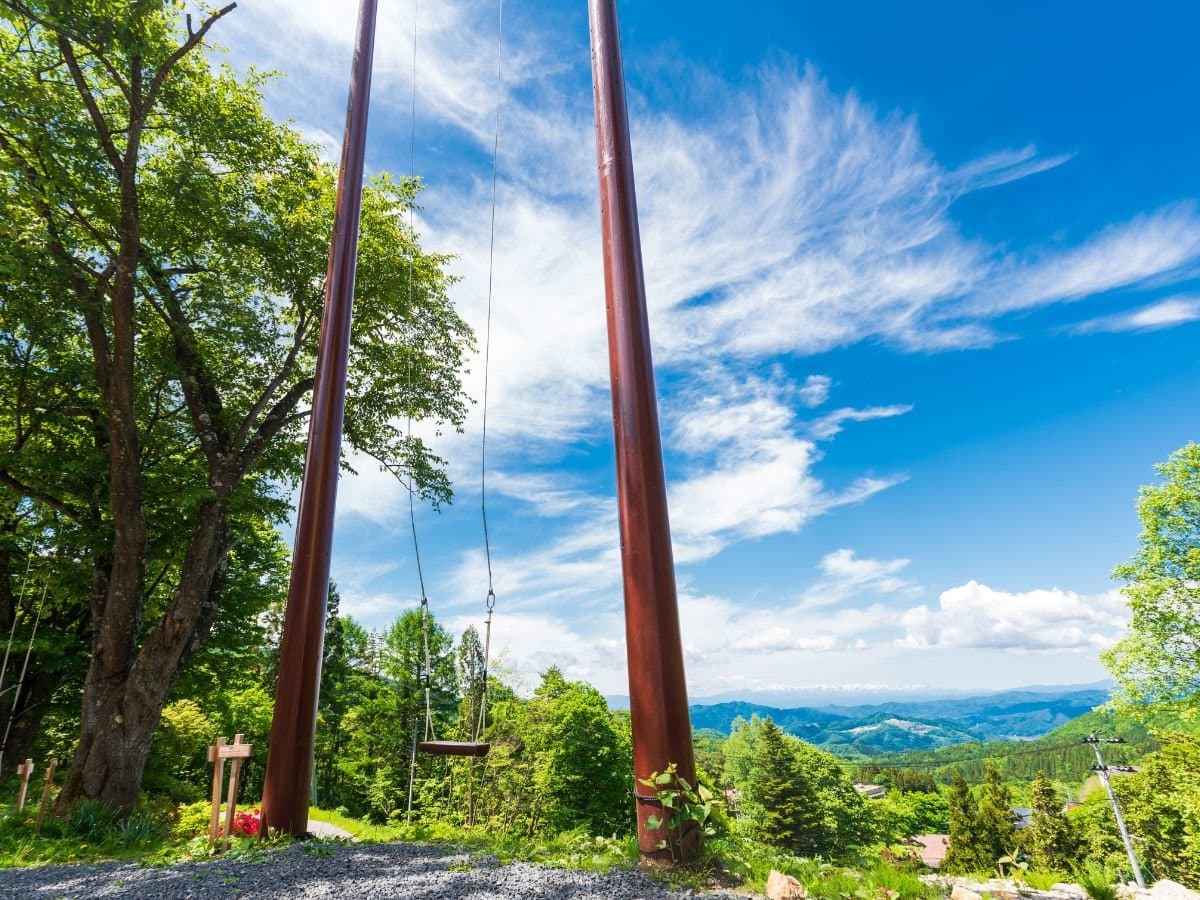 Large garden swing overlooking the Zao mountain valley panorama at Zenshichinoyu Ohira, Zao Onsen