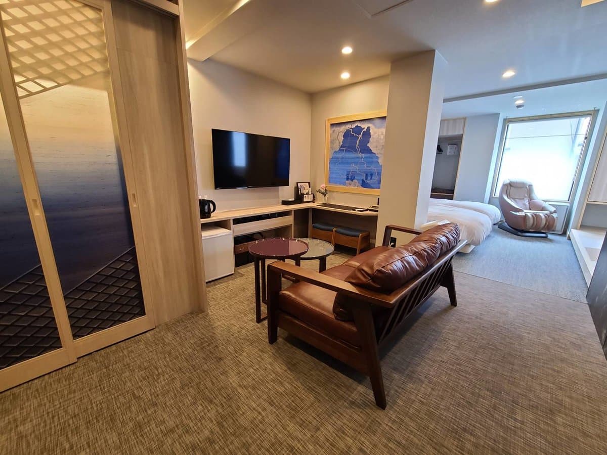Premium twin bedroom with paired beds, indirect headboard lighting and a sitting area, Koyado En, Kinosaki Onsen