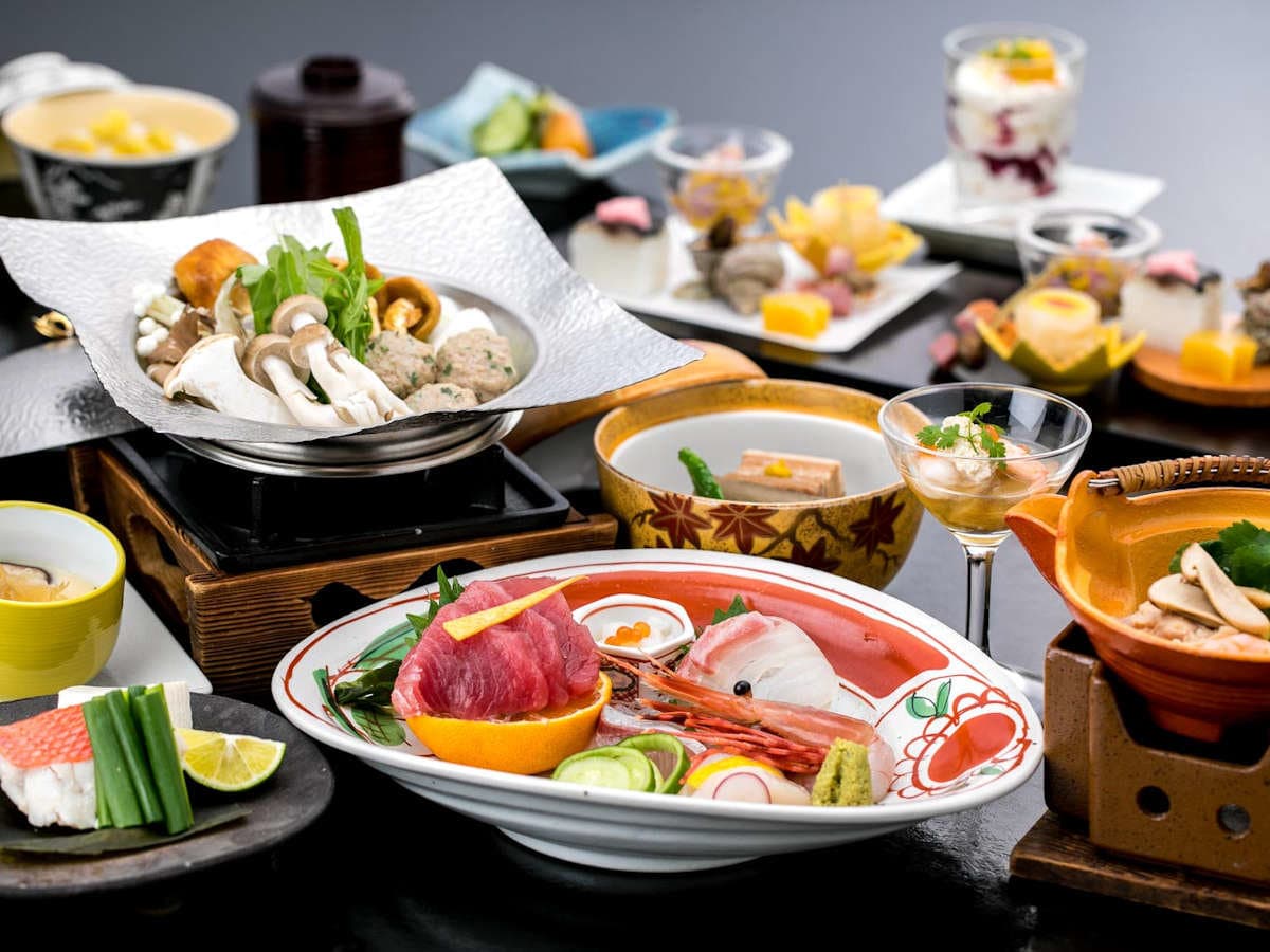 Multi-course kaiseki dinner with sashimi, mushroom hot pot and seasonal dishes at Ryokan Tachibana