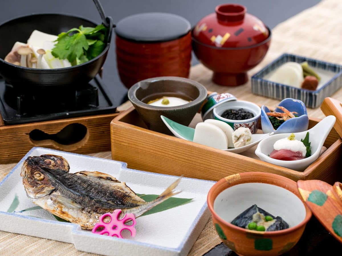Japanese breakfast set with grilled fish, small hot pot and assorted side dishes at Ryokan Tachibana in Atami
