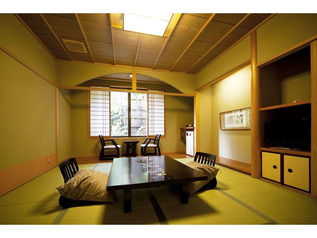 Guest room at Tsuki no Shizuku with large windows and artistic interior