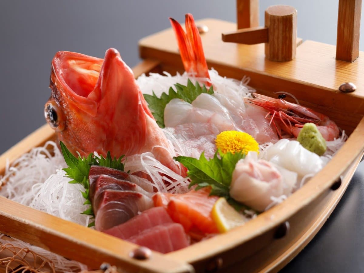 Fresh sashimi platter served on a boat at Oyado Seri