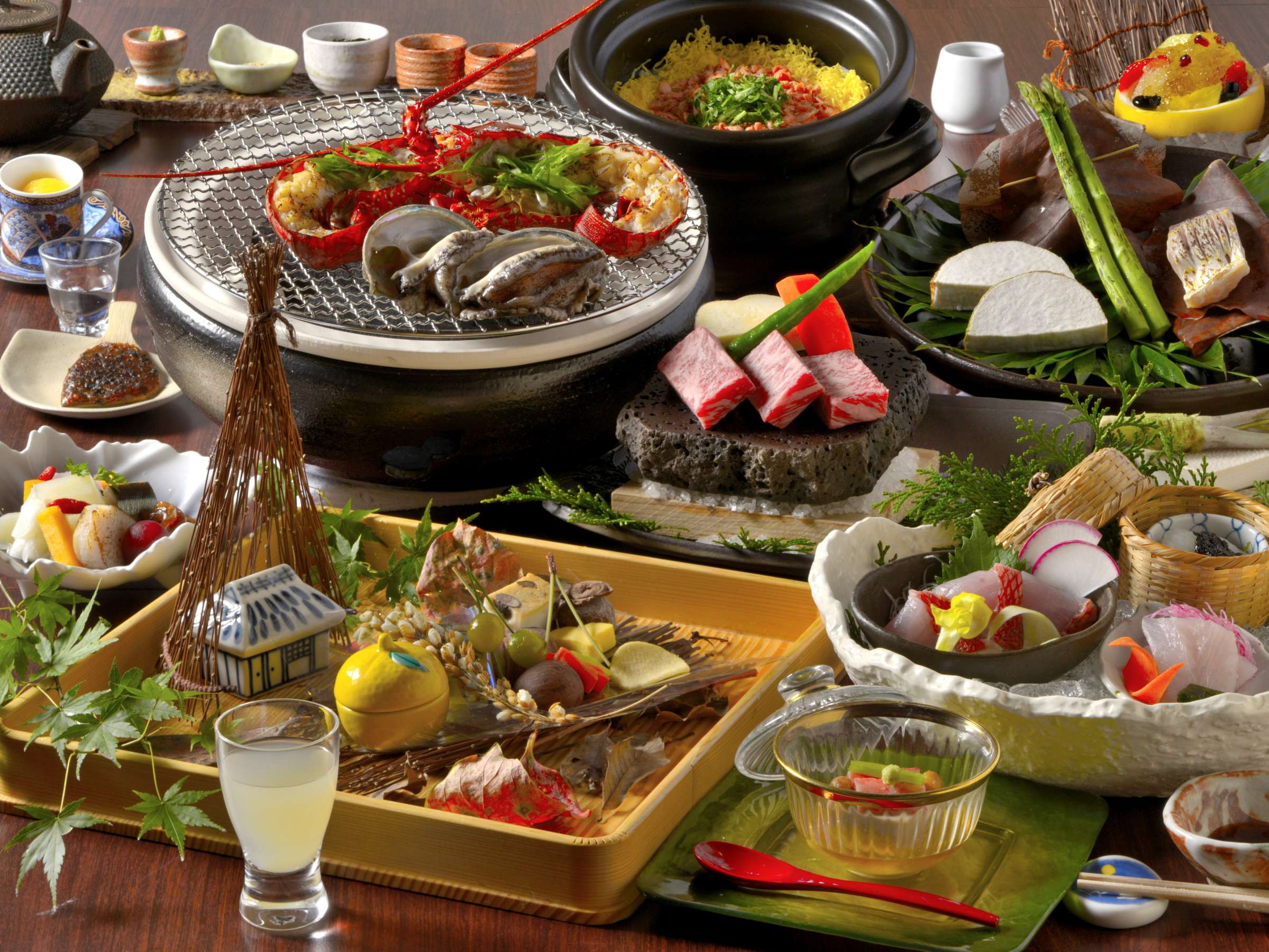 Multi-course kaiseki dinner spread with grilled seafood, wagyu beef and seasonal small dishes at Tsuki no Usagi, Izu
