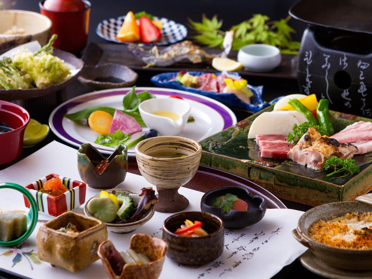 Multi-course kaiseki dinner at Hozantei laid out with sashimi, wagyu and seasonal dishes