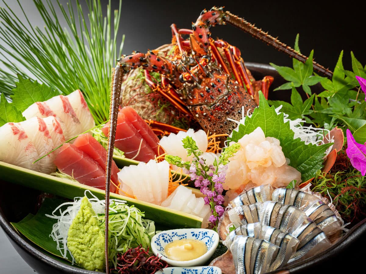 Fresh seafood sashimi platter with spiny lobster and assorted fish served at Ibusuki Phoenix Hotel