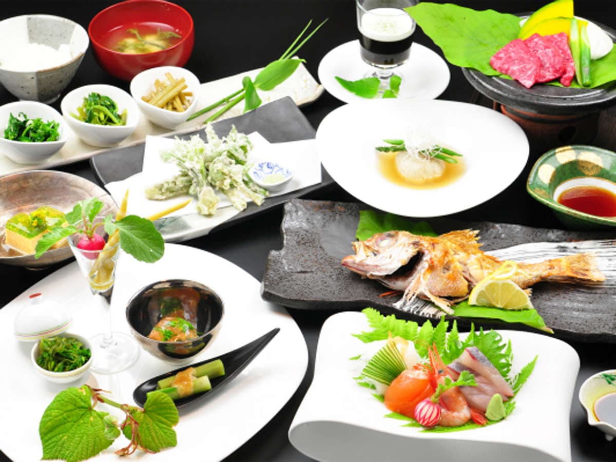 Multi-course kaiseki dinner spread at Hakuba Hifumi with grilled fish, sashimi, tempura and wagyu beef