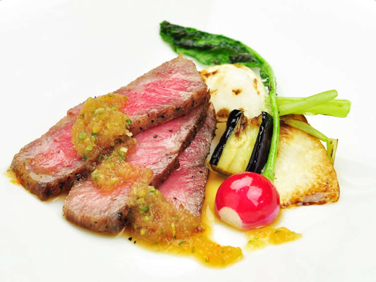 Plated wagyu beef course with grilled seasonal vegetables served at Hakuba Hifumi