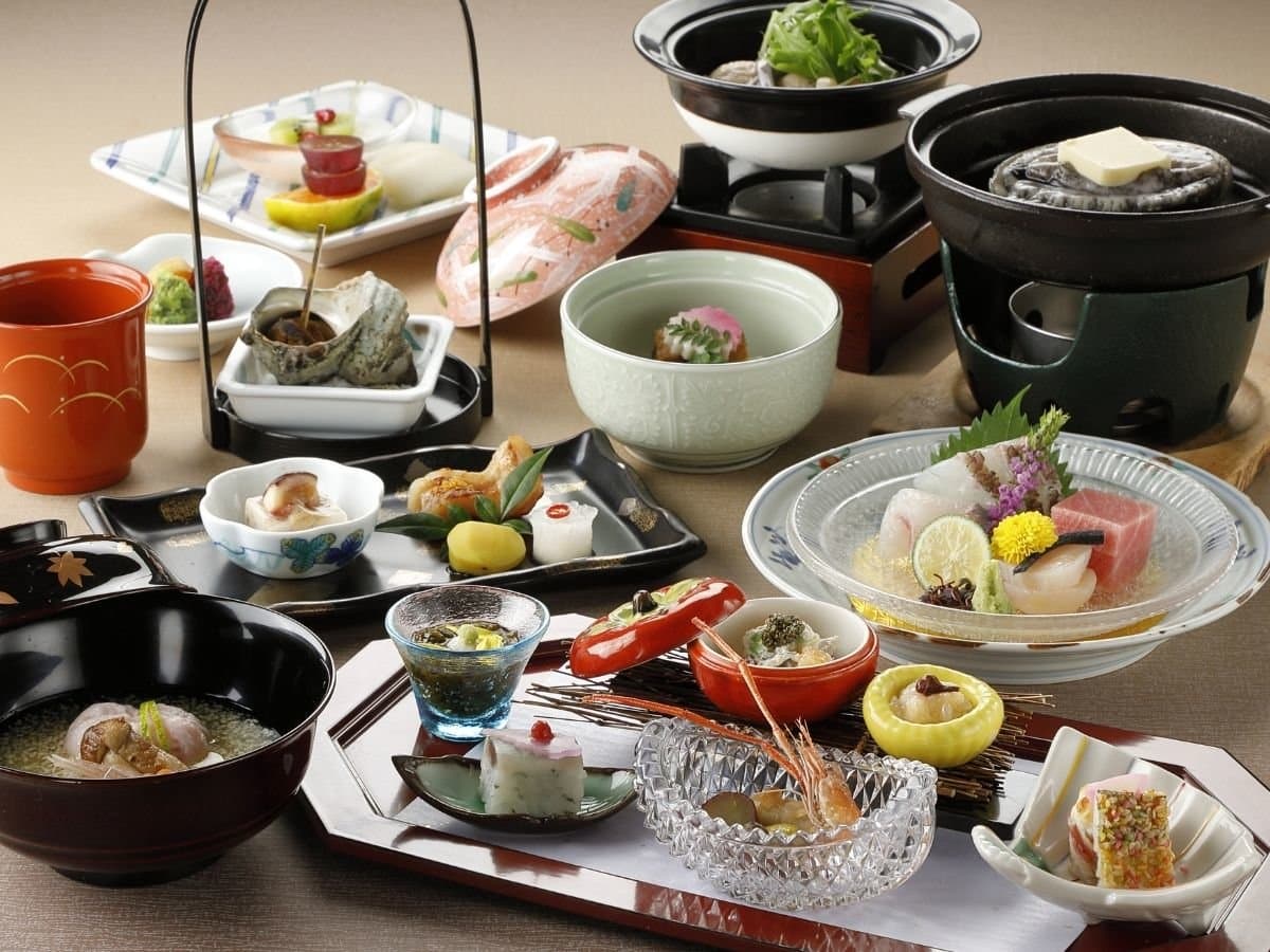 Multi-course Japanese kaiseki dinner with sashimi, hot pot and seasonal small dishes