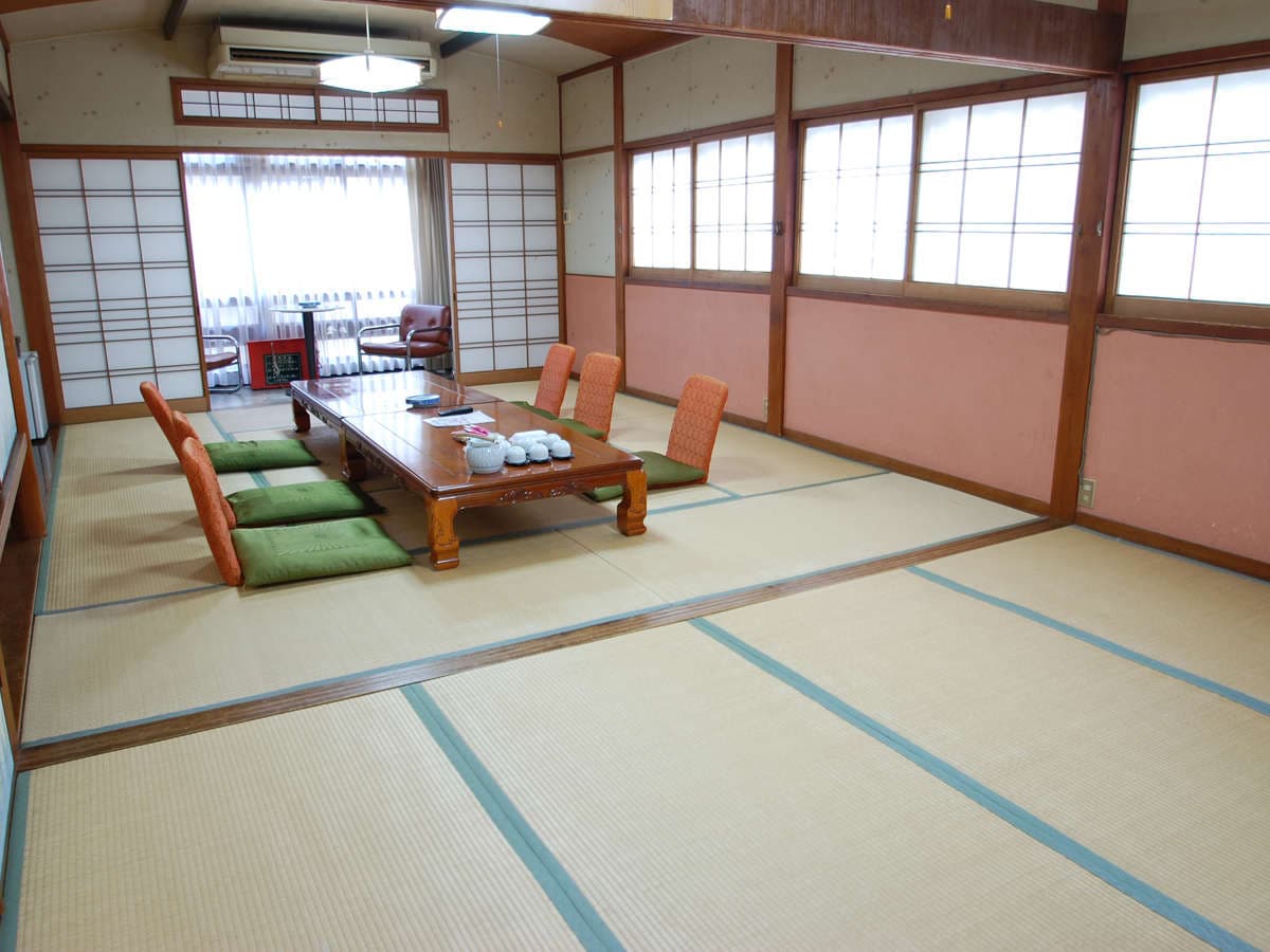 Tatami guest room at Fujimiya with a low table and garden-view window