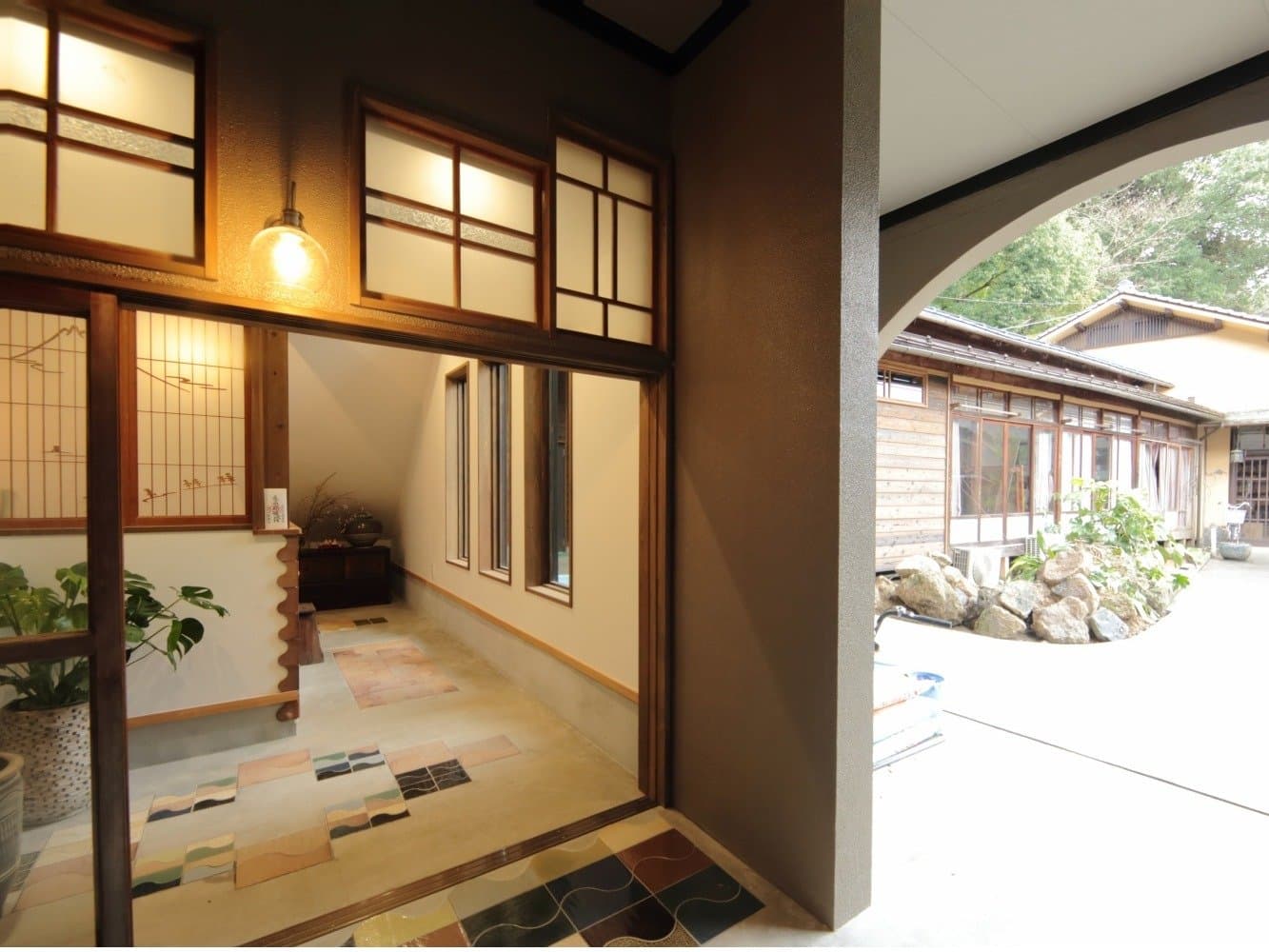 Entrance hallway at Fujimiya opening onto a garden view