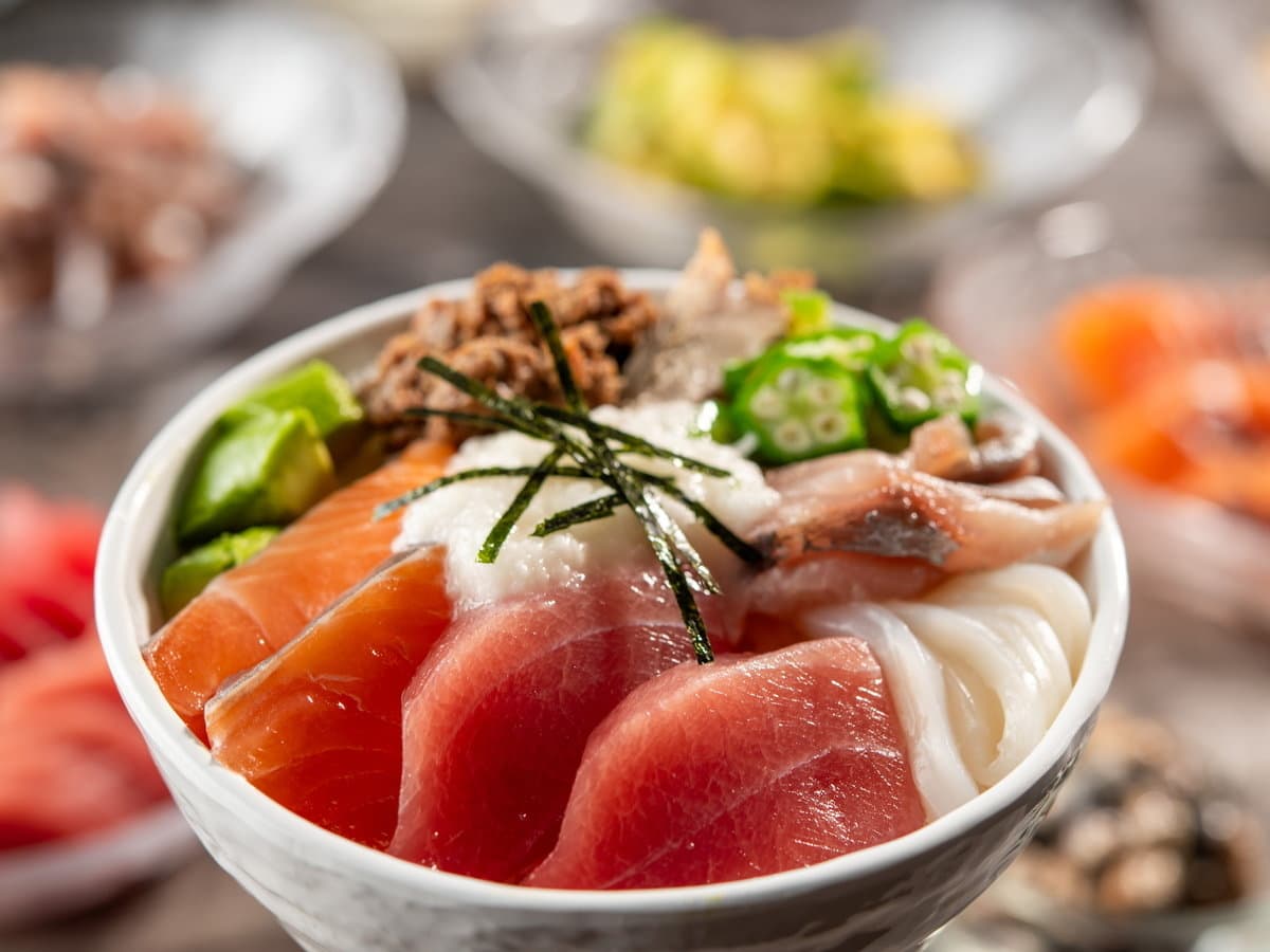 Kamenoi original mountain-and-sea kaiseki rice bowl topped with tuna, salmon, grated yam and okra