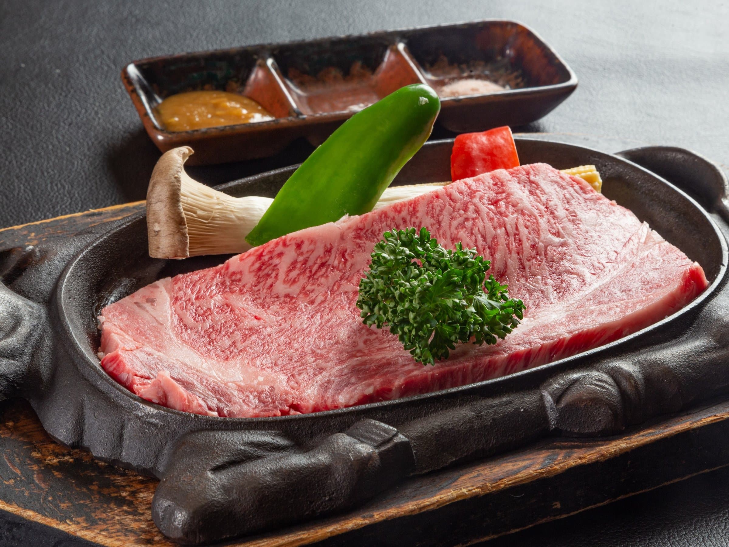 Marbled wagyu beef steak with vegetables on a cast-iron plate at Zao Plaza Hotel dinner