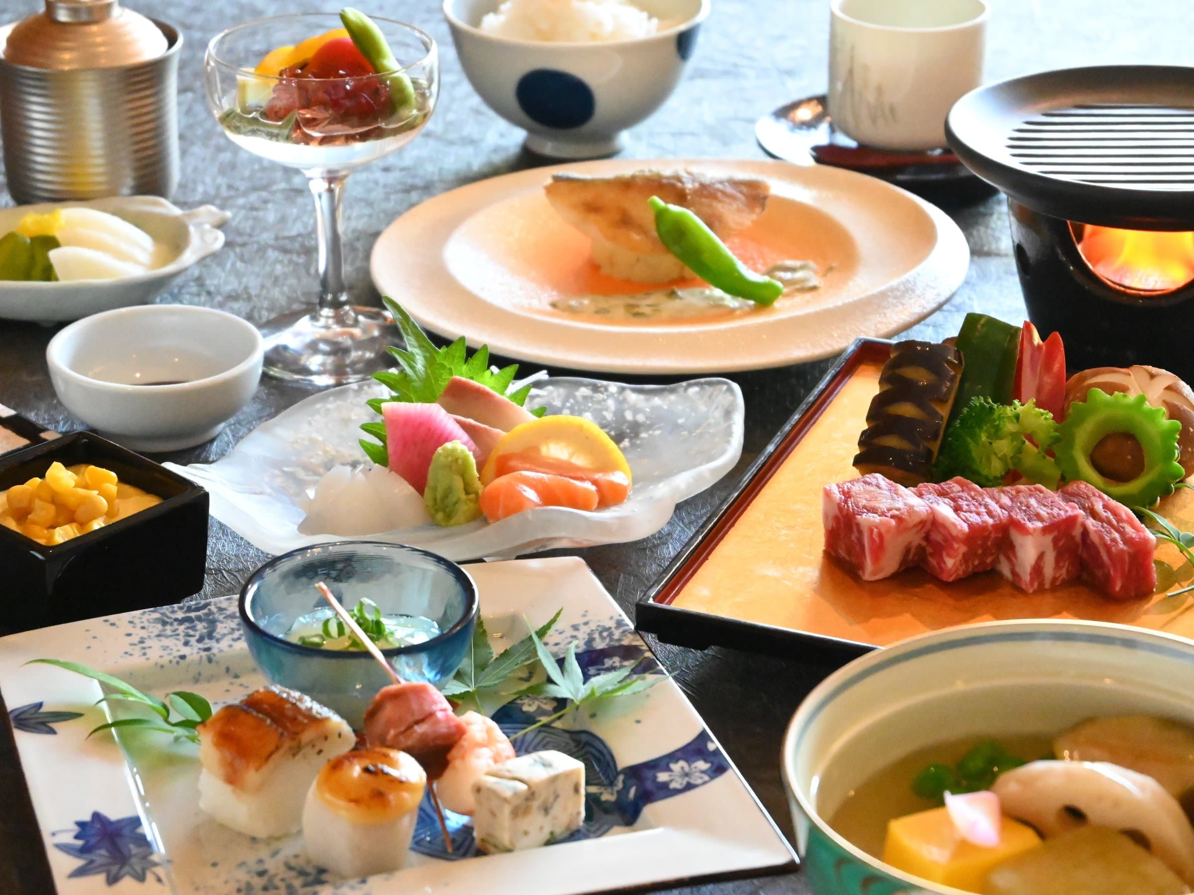 Multi-course kaiseki dinner with sashimi, grilled wagyu and seasonal dishes at Hotel Higuchiken