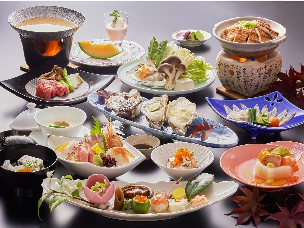 Multi-course Japanese kaiseki dinner with sashimi, beef hot pot and oysters at Miyajima Hotel Makoto