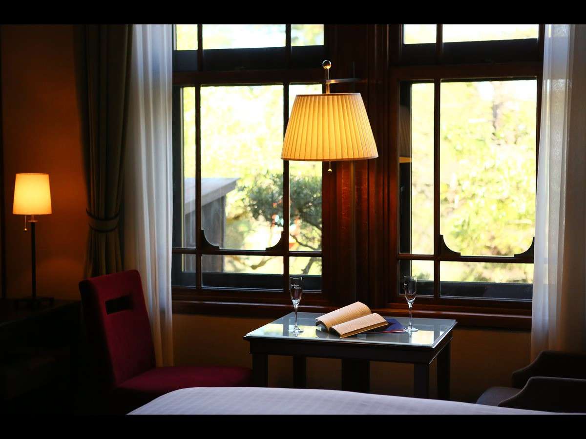 Dining table by a window at Nara Hotel framing the five-story pagoda of Kofuku-ji temple in Nara