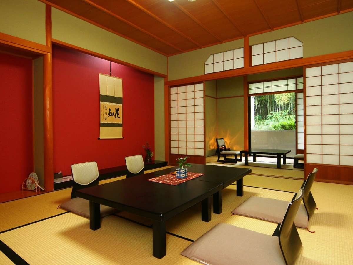 Premium Japanese-style room with hanging scroll, red accent wall and garden view at Oyado Yamashita, Yuwaku Onsen