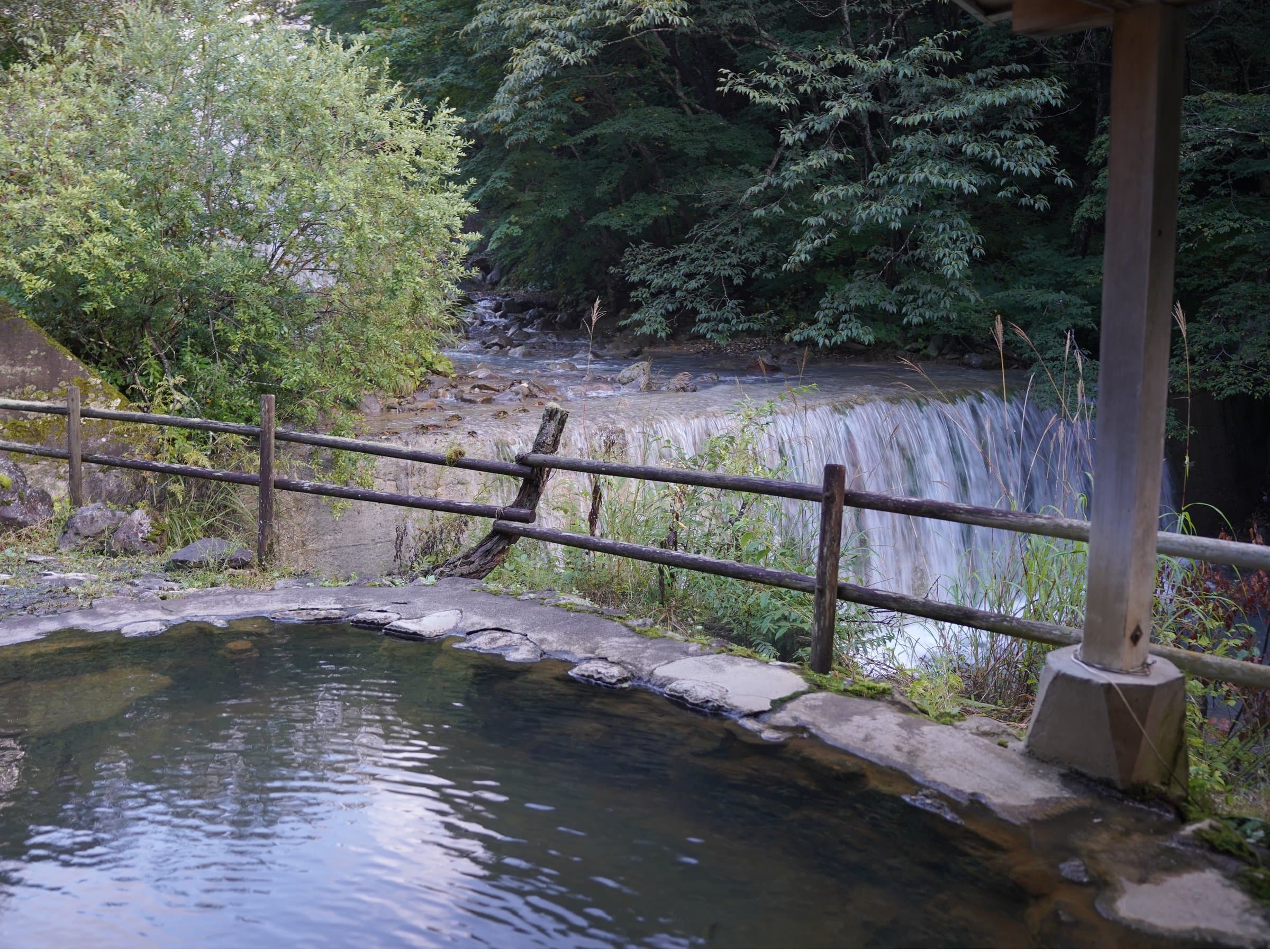 Open-air riverside rock hot spring bath