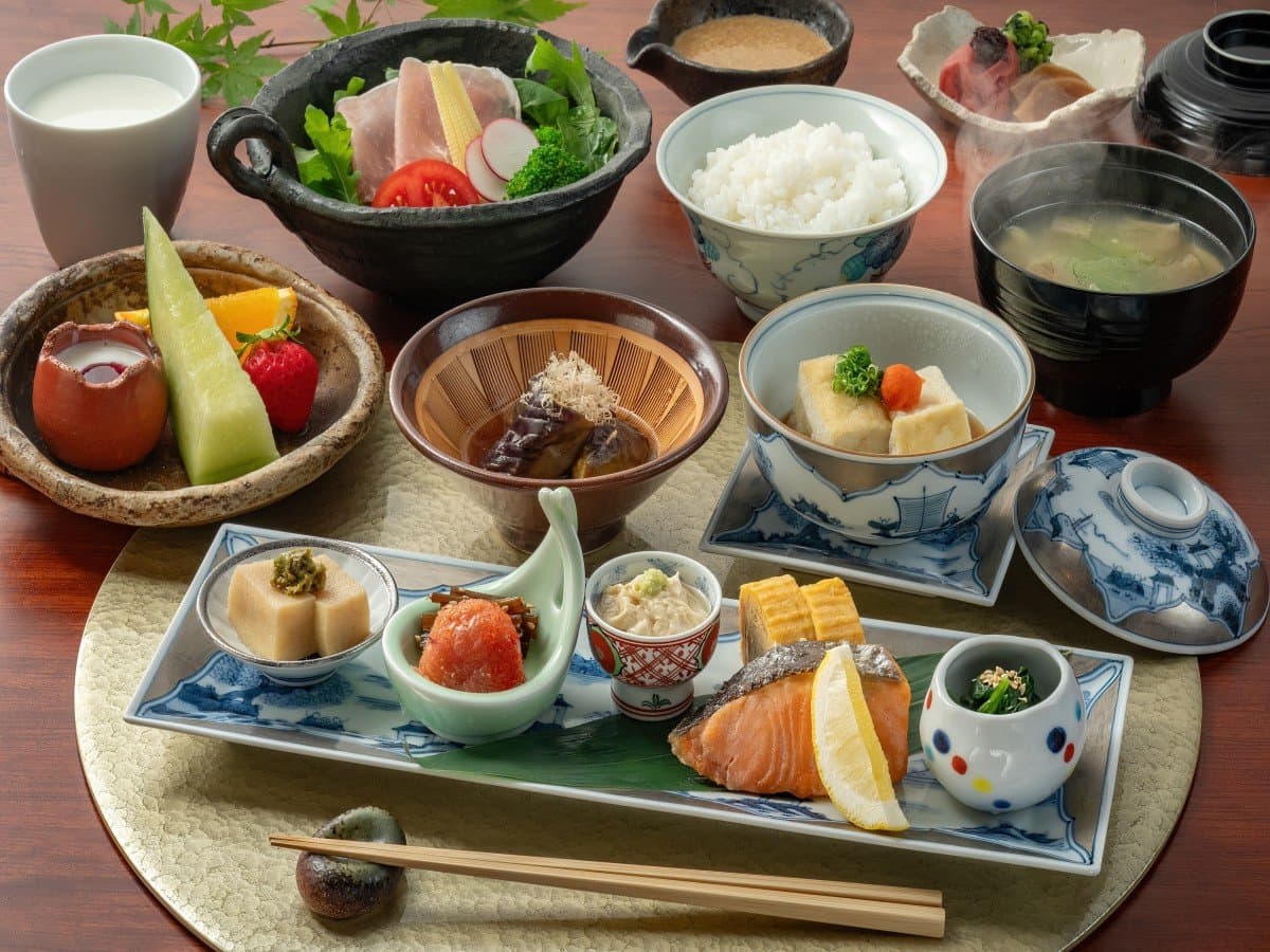 Japanese breakfast set at Oyado Nonohana with rice, grilled fish and assorted side dishes