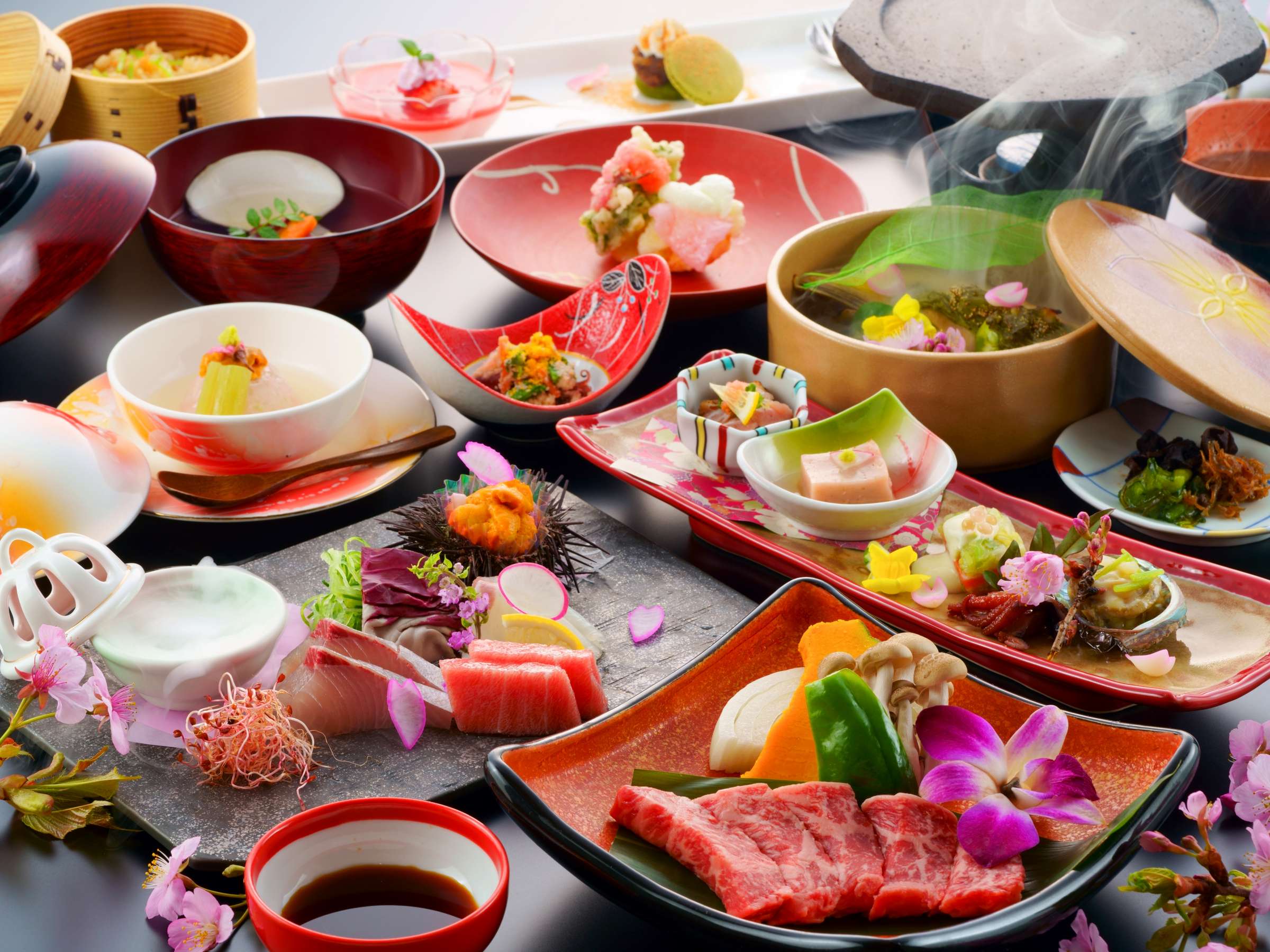 Steaming kaiseki dinner spread of seafood, beef and seasonal courses served at Yufuin Hanayoshi