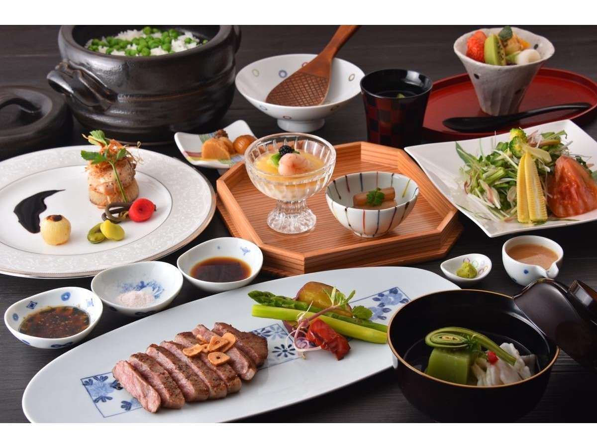 Seasonal kaiseki dinner spread with wagyu, sashimi and assorted small dishes at Okunikko Yuno-mori