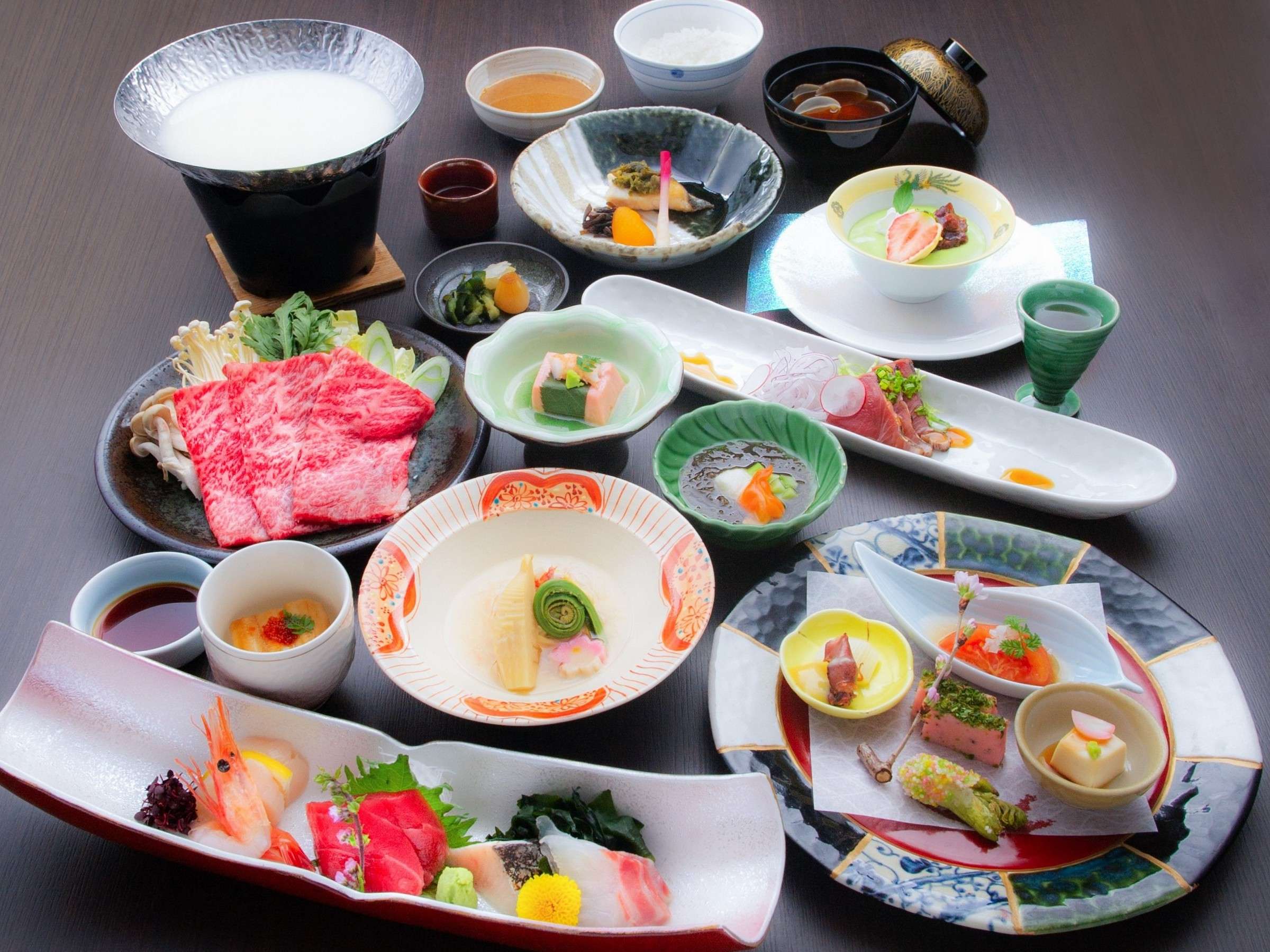 Multi-course kaiseki dinner spread with Tochigi wagyu beef, sashimi and seasonal small dishes at Okunikko Kogen Hotel