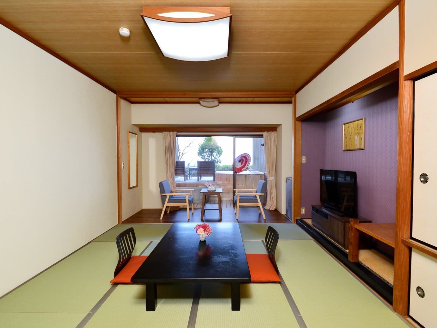 Spacious 10-tatami Japanese guest room with low table and private open-air bath balcony, Hotel Katara Izu