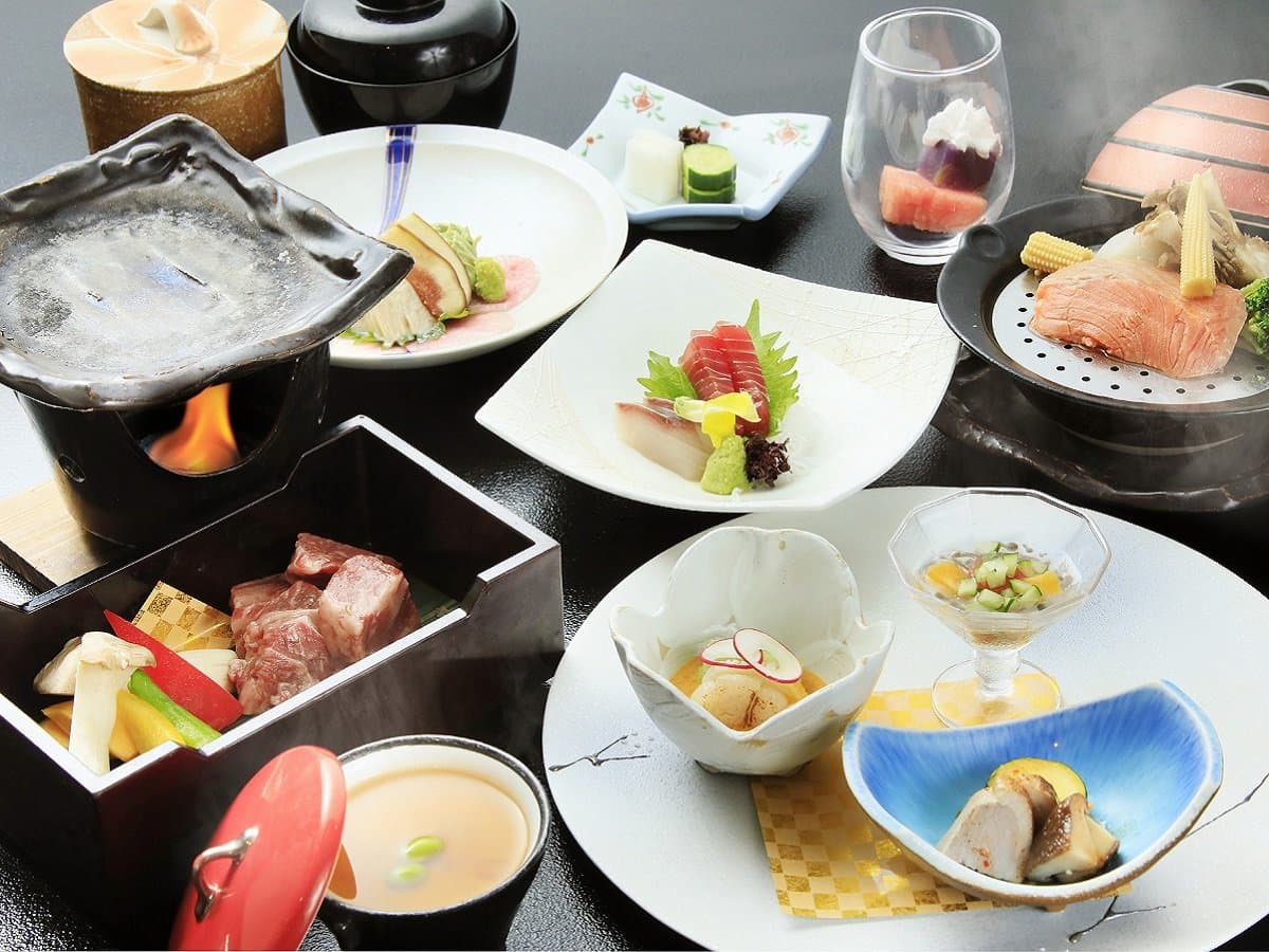 Kaiseki dinner course with steaming hot pot, sashimi and seasonal small plates at Okunikko Hotel Shikisai