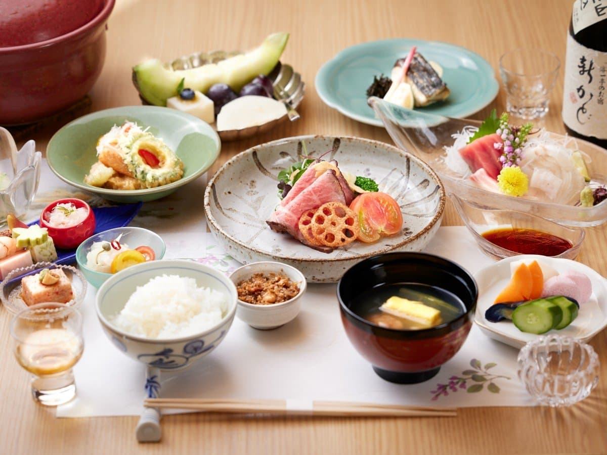 Kaiseki dinner spread at Shin Kadoya with roast beef, sashimi, rice and assorted small dishes