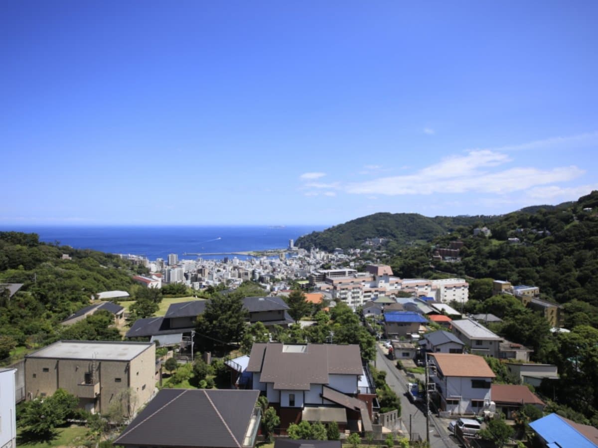 Panoramic view of Atami town and the sea seen from the hillside grounds of Atami Fuga