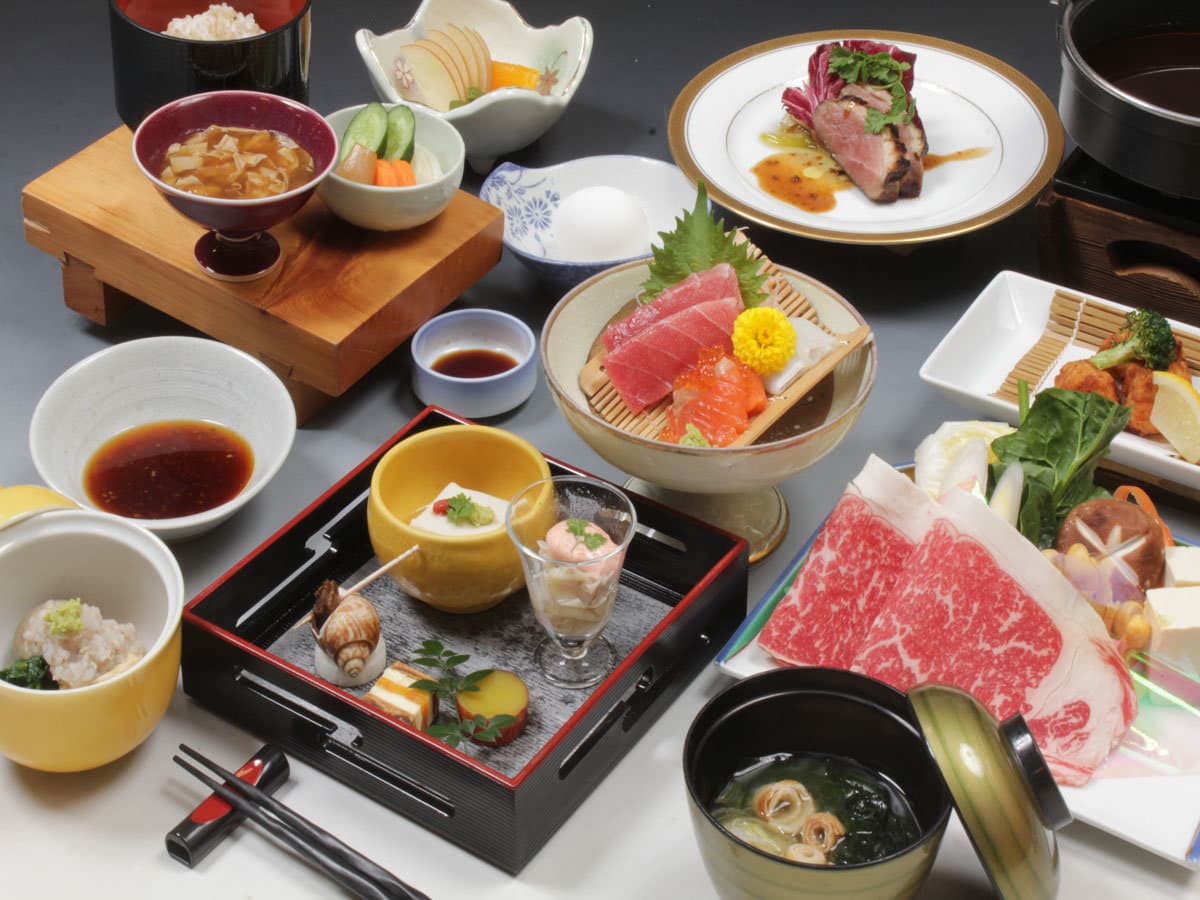 Multi-course Japanese kaiseki dinner with sashimi, wagyu beef and assorted small dishes at Hotel Harumoto in Nikko