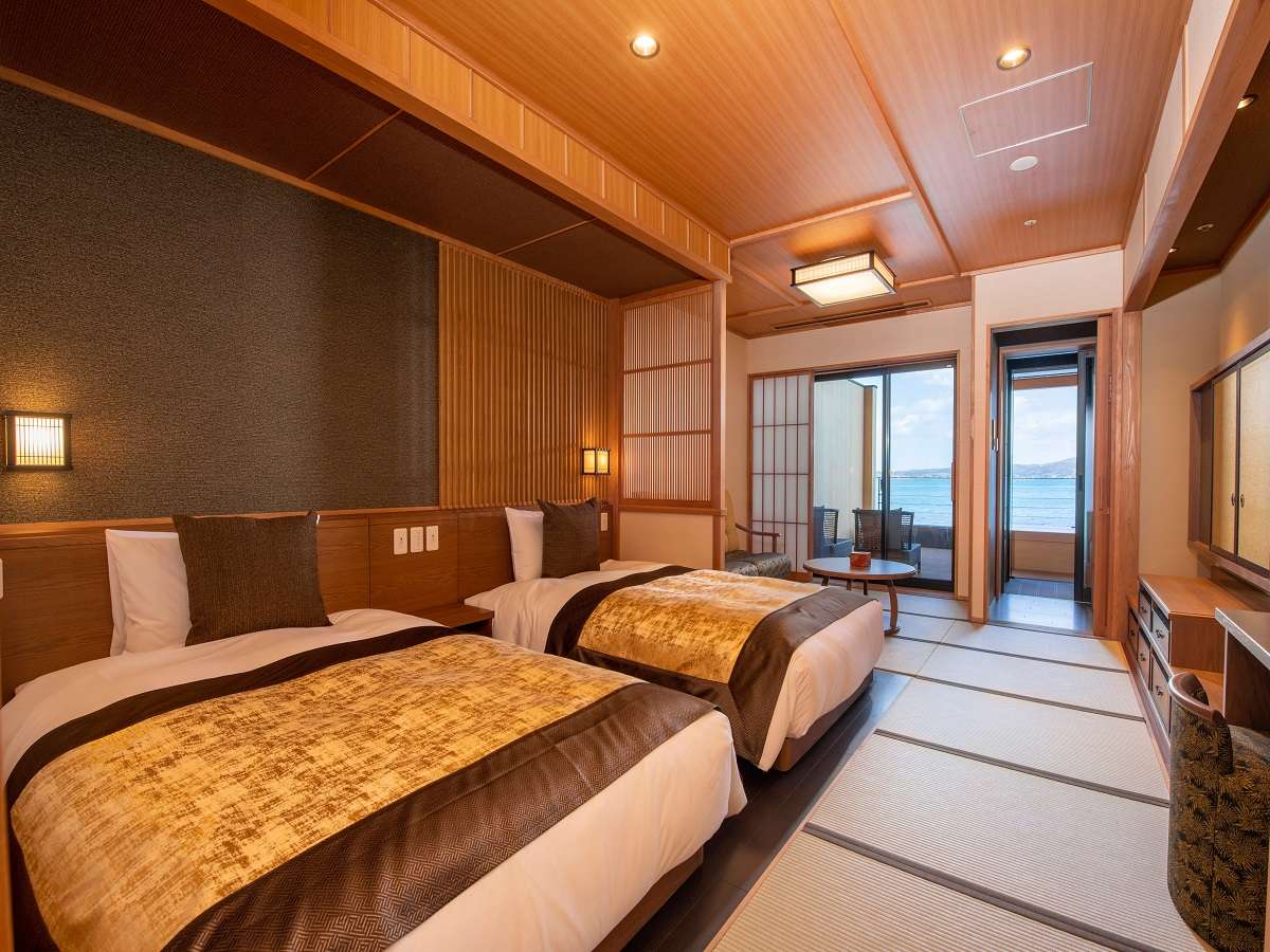 Japanese-Western twin guest room with tatami floor and Nanao Bay sea view at Noto Kaishu, Wakura Onsen
