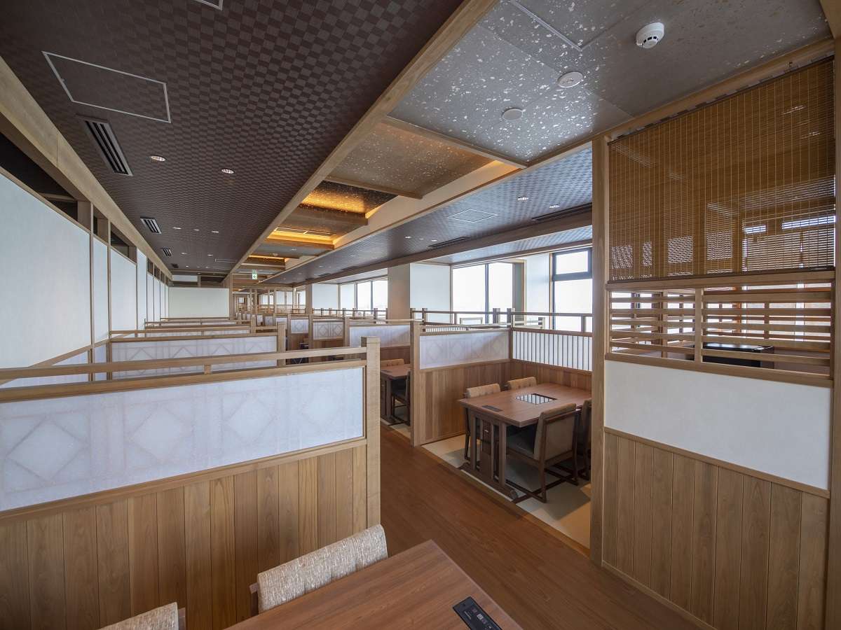 Private semi-enclosed dining booths with bay-view windows at Noto Kaishu in Wakura Onsen