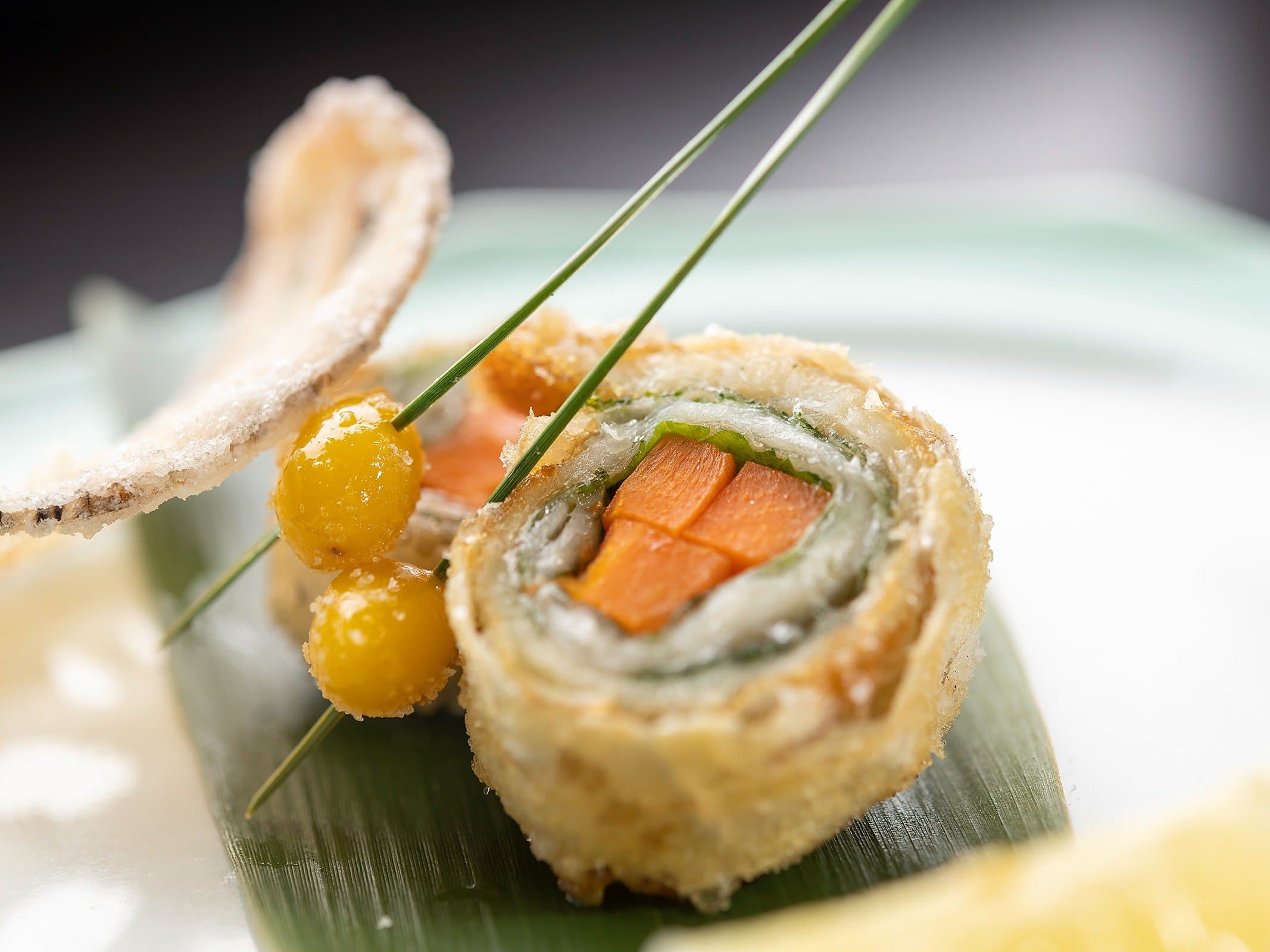 Close-up of a delicate fried kaiseki course at Yado Taniya plated on a celadon dish