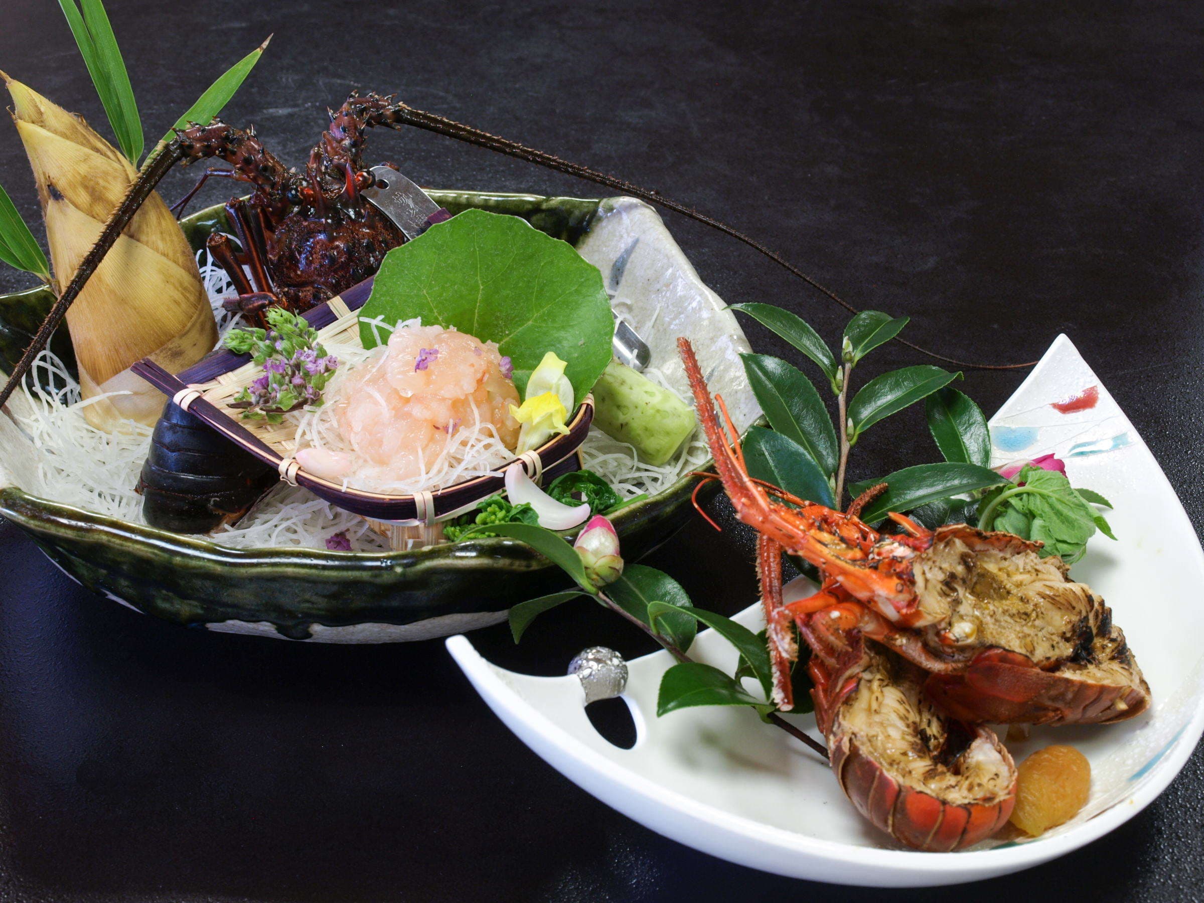 Spiny lobster sashimi and grilled lobster plated on leaf-shaped dishes at Chikurinan Mizuno