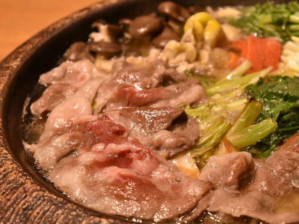Wagyu sukiyaki hot pot with seasonal vegetables simmering in an iron pan at Fufu Kawaguchiko