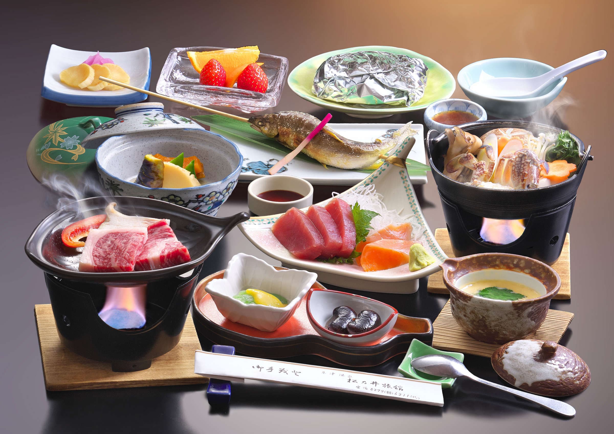 Multi-course kaiseki dinner with sashimi, grilled fish and individual hotpots