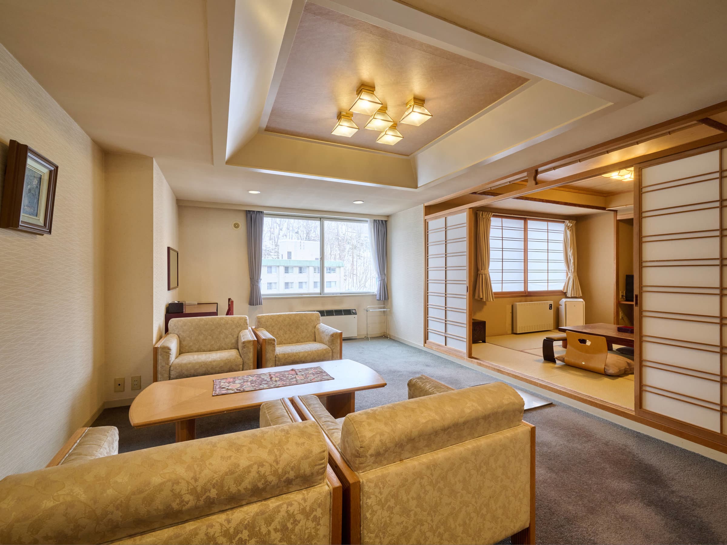 Premium suite with sofa lounge and adjoining tatami area at Oyado Kiyomizuya, Noboribetsu