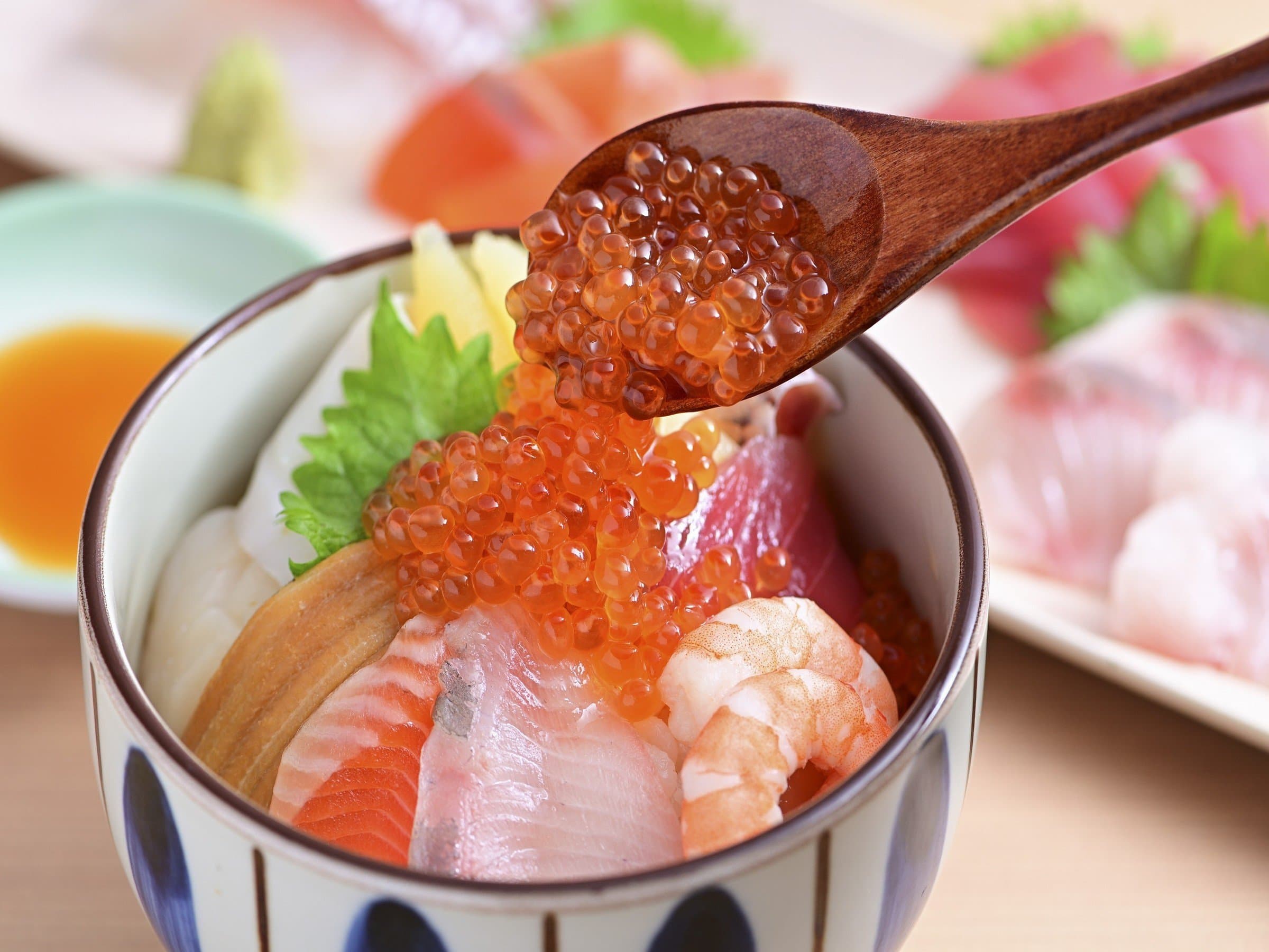 Fresh seafood rice bowl topped with salmon roe, sashimi and shrimp served at Noboribetsu Manseikaku
