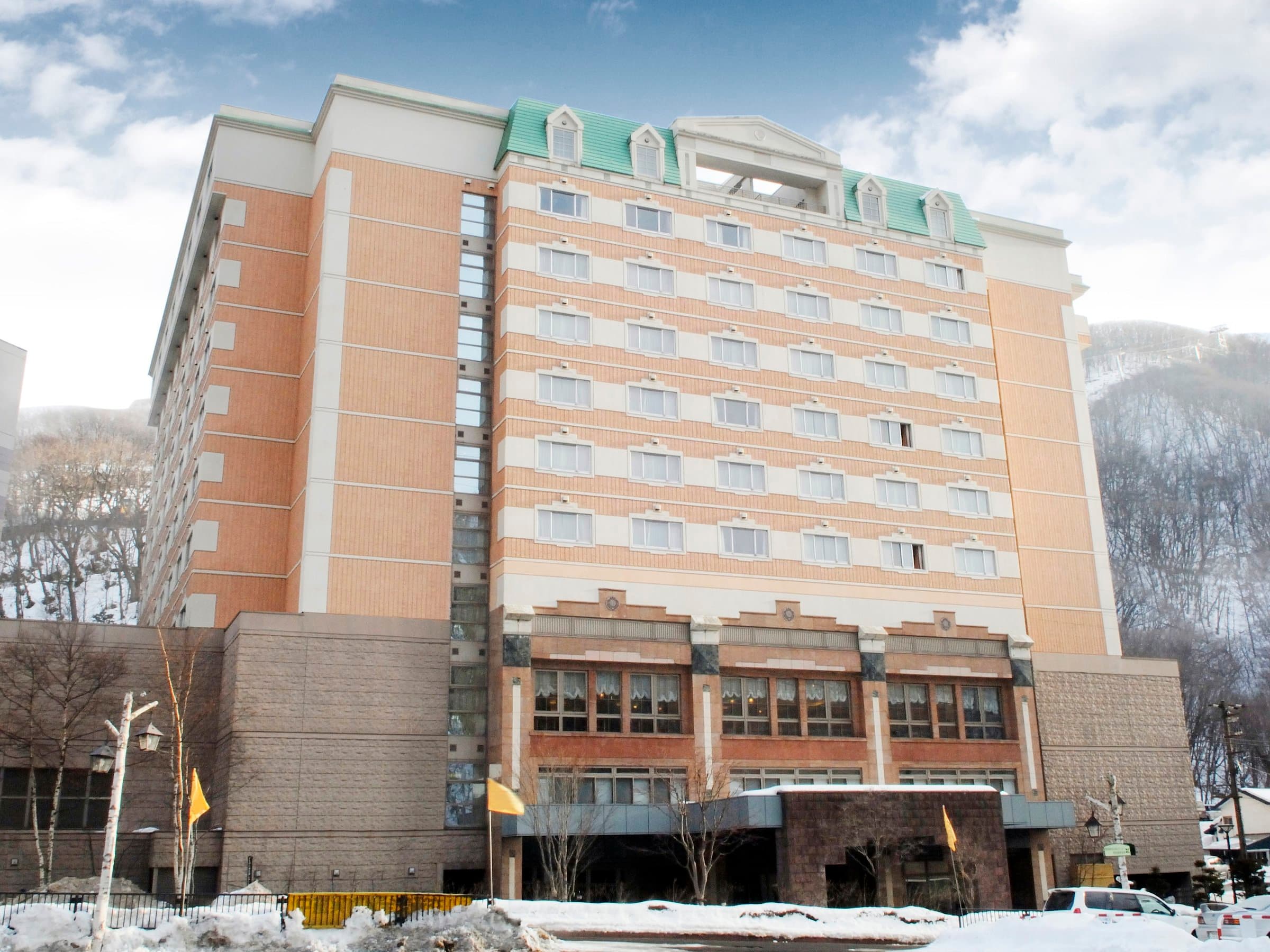 Noboribetsu Manseikaku exterior in winter, the multi-story hotel surrounded by snow at Noboribetsu Onsen, Hokkaido