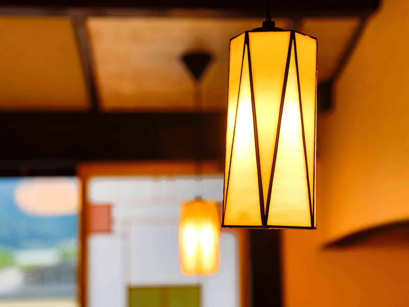 Yumekoyado Tenbouen Kinosaki Onsen guest room with twin beds and warm lantern lighting