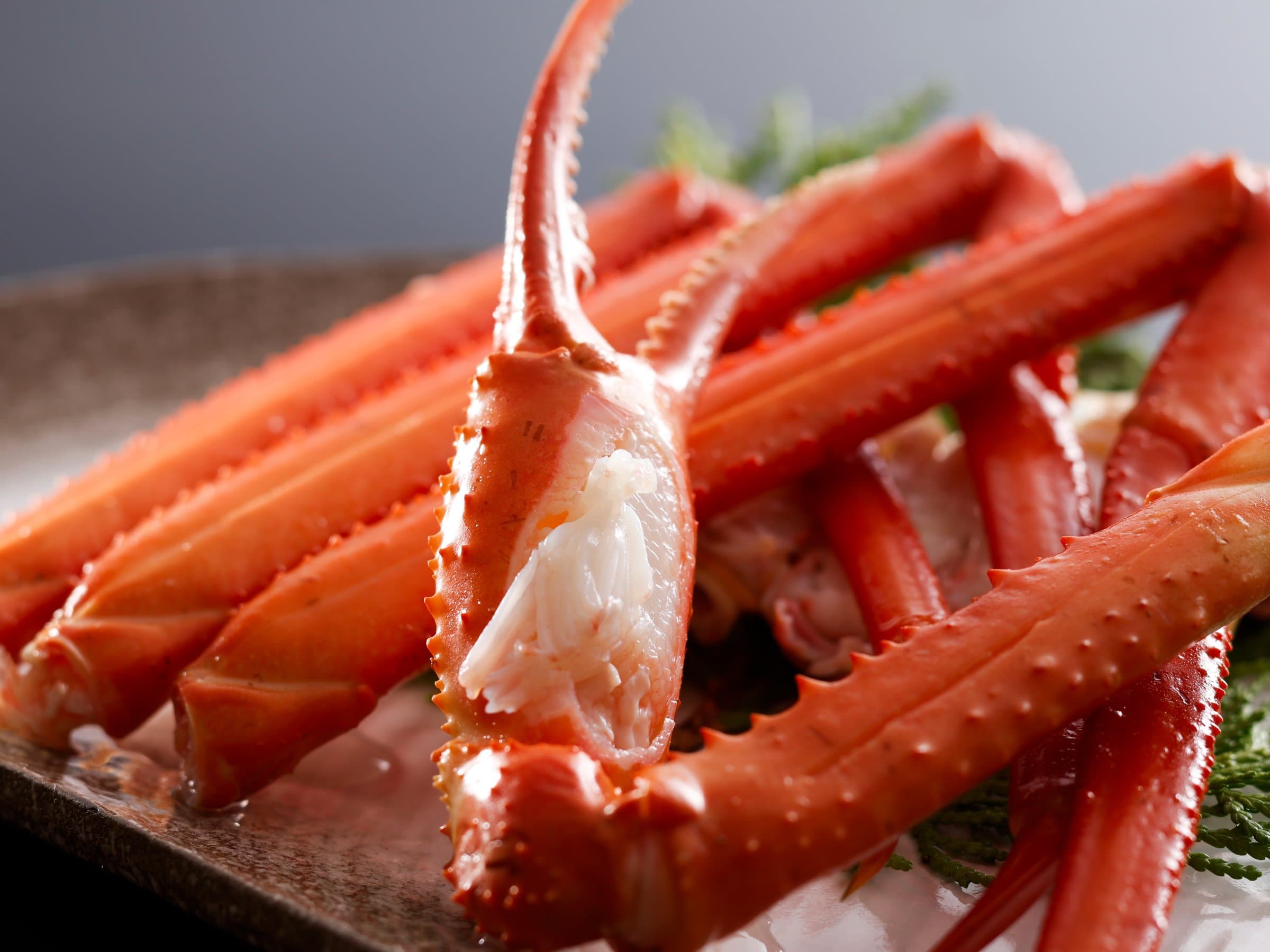 Whole boiled snow crab legs plated on ice, the signature winter delicacy, Yamamotoya, Kinosaki Onsen