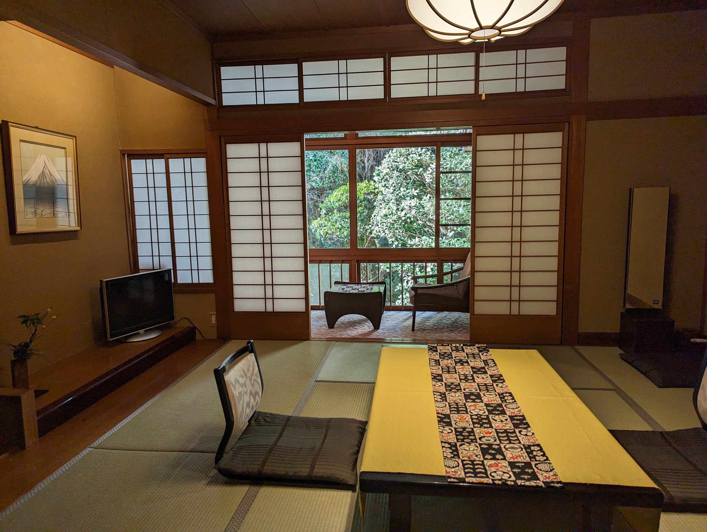 Tatami room with timber ceiling, hanging lantern and shoji doors framing the garden, Yamamotoya, Kinosaki Onsen