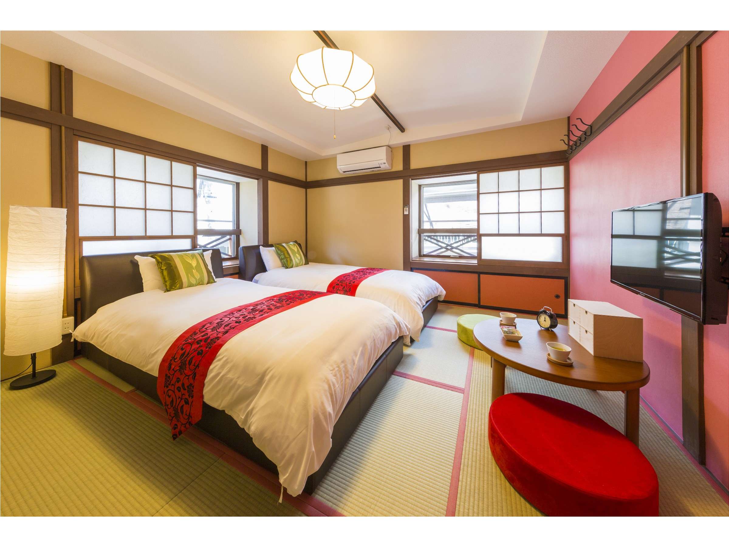 Japanese-style twin room with timber-framed walls, woodgrain closet and frosted shoji window