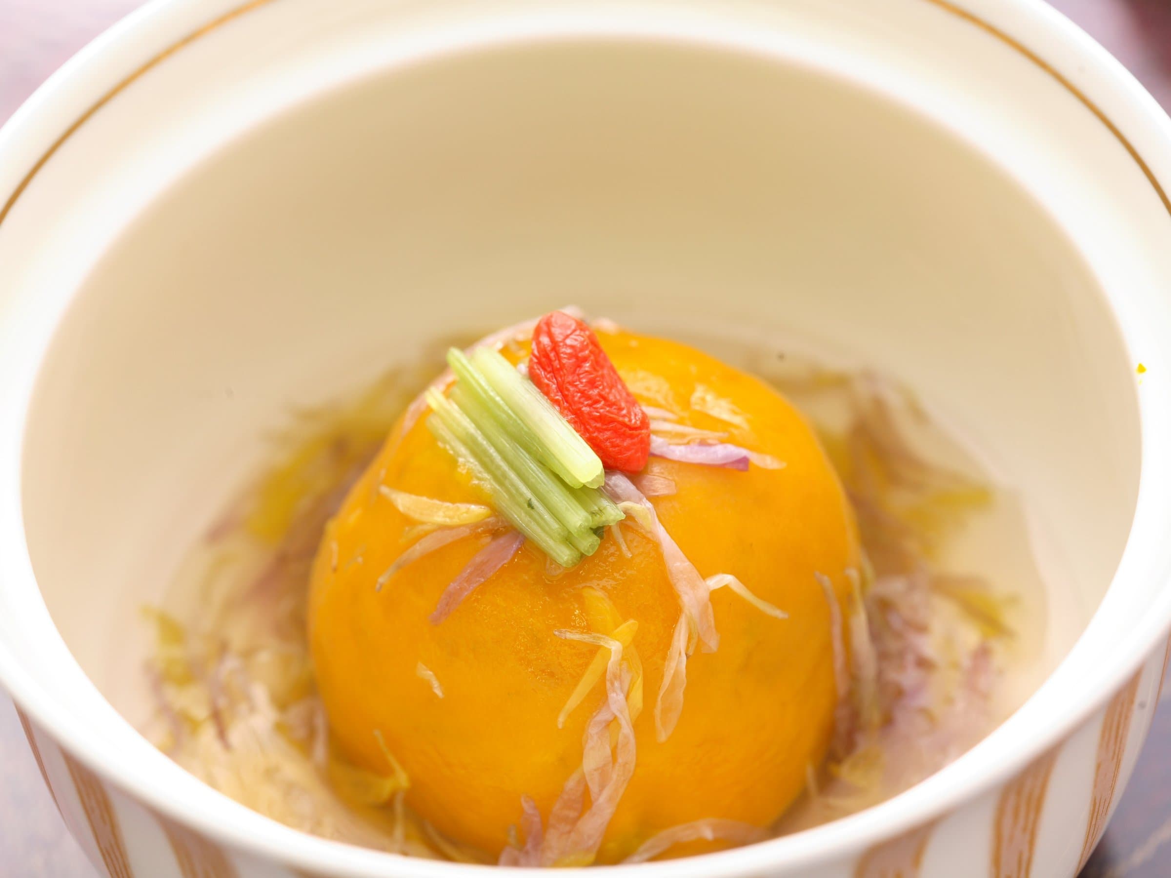 Simmered seasonal dish in broth served at Wafu Ryokan Misato